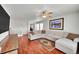 Spacious living room with hardwood floors and a large sectional sofa at 2229 Candleglow St, Castle Rock, CO 80109