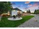 Landscaped backyard with a fire pit and seating area at 3360 Broadway St, Boulder, CO 80304