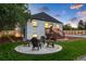 Landscaped backyard with a firepit and seating area at 3360 Broadway St, Boulder, CO 80304