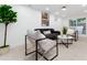 Finished basement lounge with a sofa, chairs, and sliding glass doors at 3360 Broadway St, Boulder, CO 80304