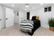 Basement bedroom with a single bed, black bedding, and modern decor at 3360 Broadway St, Boulder, CO 80304