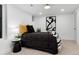 Basement bedroom with a single bed, black and white bedding, and art at 3360 Broadway St, Boulder, CO 80304