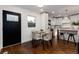 Bright dining area with glass table and modern chairs near the kitchen at 3360 Broadway St, Boulder, CO 80304