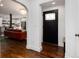 Clean entryway with dark wood floors and a black door with glass accents at 3360 Broadway St, Boulder, CO 80304