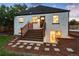 Back of the house with a wooden deck and landscaping at 3360 Broadway St, Boulder, CO 80304