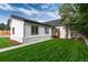 Charming ranch home with a well-manicured lawn and walkway at 3360 Broadway St, Boulder, CO 80304