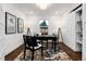 Home office with a desk, built-in shelving, and hardwood floors at 3360 Broadway St, Boulder, CO 80304
