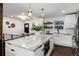 Modern kitchen with white cabinets, granite countertops, and a large island at 3360 Broadway St, Boulder, CO 80304