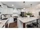 Modern kitchen with white cabinets, stainless steel appliances and a large island at 3360 Broadway St, Boulder, CO 80304