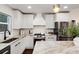 Modern kitchen with white cabinets, granite countertops, and stainless steel appliances at 3360 Broadway St, Boulder, CO 80304