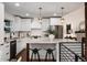 Modern kitchen with white cabinets, a large island, and stainless steel appliances at 3360 Broadway St, Boulder, CO 80304