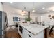 Open concept kitchen with island and stainless steel appliances at 3360 Broadway St, Boulder, CO 80304