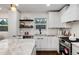 Modern kitchen with white cabinets and granite countertops at 3360 Broadway St, Boulder, CO 80304