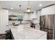 Modern kitchen featuring white cabinets, granite countertops, and stainless steel appliances at 3360 Broadway St, Boulder, CO 80304