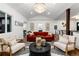 Bright living room featuring a red sofa and stylish decor at 3360 Broadway St, Boulder, CO 80304