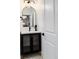 Modern powder room with black vanity and patterned tile floor at 3360 Broadway St, Boulder, CO 80304