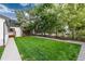 Landscaped side yard with lush grass and stone pathway at 3360 Broadway St, Boulder, CO 80304