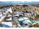 Aerial view showing community clubhouse, tennis courts, and surrounding landscape at 13739 E Marina Dr # B, Aurora, CO 80014