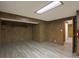 Finished basement with wood paneling and multiple rooms at 13739 E Marina Dr # B, Aurora, CO 80014