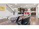 Open concept dining area with modern table and chairs and kitchen view at 4122 Spanish Oaks Trl, Castle Rock, CO 80108