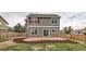 This backyard features an extended patio, lush grass, and a fenced perimeter at 1488 N Stratton Ave, Castle Rock, CO 80104