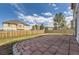Backyard features a large stone patio, fence and grass at 1488 N Stratton Ave, Castle Rock, CO 80104