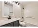 Bathroom features single sink vanity, updated fixtures, and tub shower combo at 1488 N Stratton Ave, Castle Rock, CO 80104