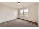 This bedroom features neutral walls and carpet plus a window with neighborhood views at 1488 N Stratton Ave, Castle Rock, CO 80104