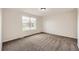Cozy bedroom with neutral carpet, ample natural light from a large window, and spacious layout at 1488 N Stratton Ave, Castle Rock, CO 80104