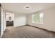 Spacious carpeted bedroom with view to en-suite bathroom, double door closet and large window at 1488 N Stratton Ave, Castle Rock, CO 80104