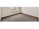 This bedroom features neutral walls, a big window and carpeted floors at 1488 N Stratton Ave, Castle Rock, CO 80104