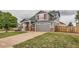Charming two-story home featuring a gray exterior, red shutters, and well-maintained landscaping in a desirable neighborhood at 1488 N Stratton Ave, Castle Rock, CO 80104