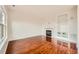 Bright living room with hardwood floors, a fireplace, and custom built-in shelving at 1488 N Stratton Ave, Castle Rock, CO 80104