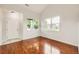 Inviting living room featuring hardwood floors, large windows, and ample natural light, perfect for Gathering gatherings at 1488 N Stratton Ave, Castle Rock, CO 80104