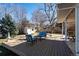 Inviting back deck with outdoor seating, perfect for enjoying the serene backyard at 8274 S Jackson St, Centennial, CO 80122