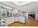 Bright eat-in kitchen featuring white cabinetry, granite countertops, and stainless steel appliances at 8274 S Jackson St, Centennial, CO 80122