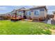 Well-maintained backyard featuring a wooden deck and patio area for outdoor enjoyment at 18027 Telford Ave, Parker, CO 80134