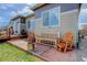 Relaxing backyard area with rustic wooden seating and a fire pit for cozy evenings at 18027 Telford Ave, Parker, CO 80134