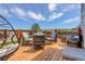 Outdoor deck with seating area, wooden flooring and mountain view at 18027 Telford Ave, Parker, CO 80134