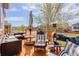 Relaxing outdoor deck featuring patio furniture, a heat lamp, and a view of the neighborhood at 18027 Telford Ave, Parker, CO 80134