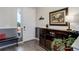 Well-lit entryway featuring modern flooring, stylish furniture, and a beautiful front door at 18027 Telford Ave, Parker, CO 80134
