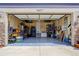 Spacious two-car garage with epoxy flooring and ample storage space at 18027 Telford Ave, Parker, CO 80134
