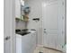 Well-equipped laundry room featuring a washer, dryer, and ample storage space at 18027 Telford Ave, Parker, CO 80134