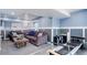 Basement living room with comfortable sofas and Pilates machine at 18027 Telford Ave, Parker, CO 80134