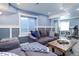 Basement living room with comfortable sofas, recessed lighting and exercise equipment at 18027 Telford Ave, Parker, CO 80134
