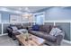Basement living room with comfortable sofas, decor and recessed lighting at 18027 Telford Ave, Parker, CO 80134