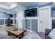 Basement living room with comfortable sofas, TV and exercise equipment at 18027 Telford Ave, Parker, CO 80134