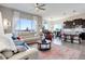 Open living space featuring a gourmet kitchen, dining area, and relaxing living room with lots of natural light at 18027 Telford Ave, Parker, CO 80134