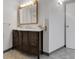 Updated full bathroom featuring a spacious vanity, framed mirror and tile flooring at 4580 W 109Th Ave, Westminster, CO 80031