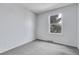 Empty bedroom features neutral walls, carpet and a window providing natural light at 4580 W 109Th Ave, Westminster, CO 80031
